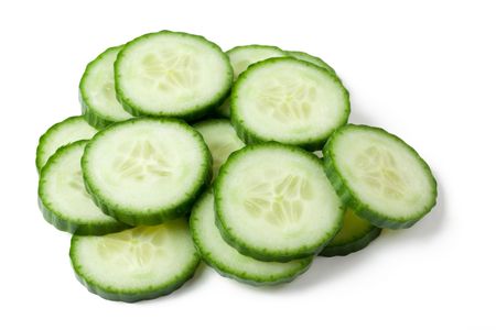 the sliced cucumber isolated on white backgroundの写真素材