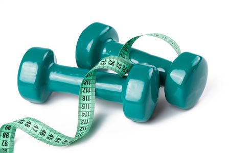 the green dumbell with measuring tape on white backgroundの写真素材