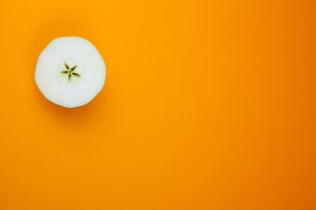 sliced apple on color backgroundの写真素材