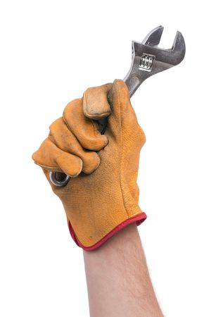 adjustable wrench in hand with gloveの写真素材