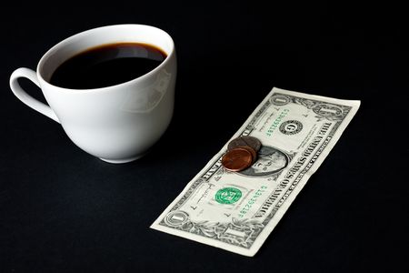 white coffee cup and money on black backgroundの写真素材