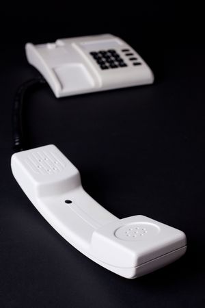the white telephone on black backgroundの写真素材