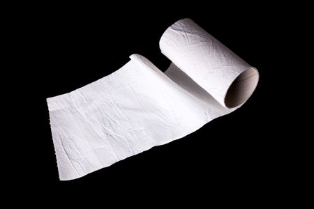 running out roll of toilet paper on black backgroundの写真素材