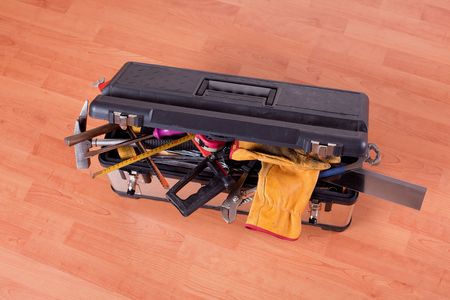 the tools in tool box on wooden floorの写真素材