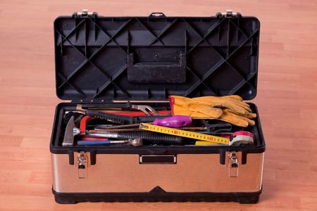 the tools in tool box on wooden floorの写真素材