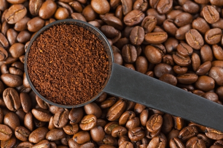 ground coffee on background with coffee beansの写真素材