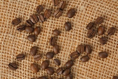 photo shot of coffee beans on juteの写真素材