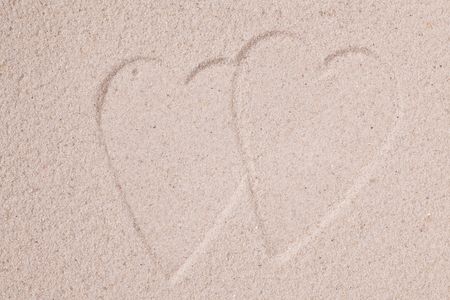 photo shot of hearts in sandの写真素材