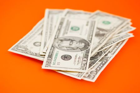 the photo shot of dollars on color background