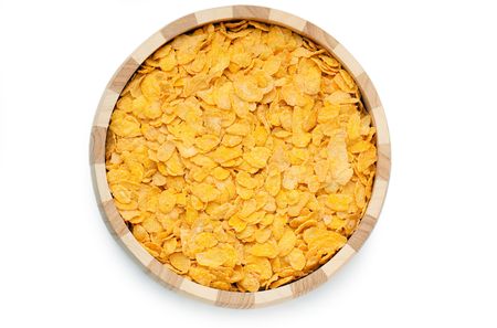 cornflakes in bowl isolated on white backgroundの写真素材