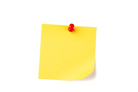 photo shot of yellow note paper with red pinの写真素材