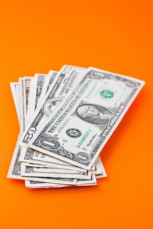 the photo shot of dollars on color backgroundの写真素材