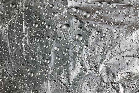 abstract background with water drops on silverの写真素材