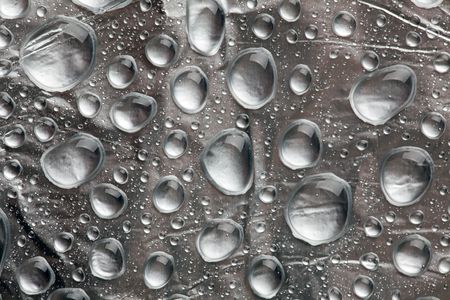 abstract background with water drops on silverの写真素材