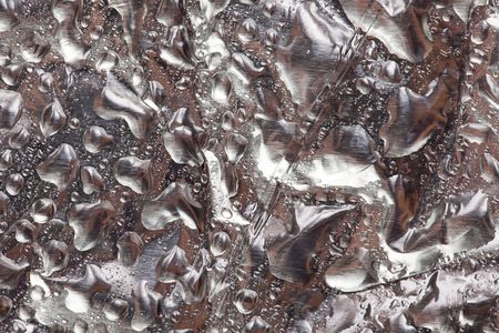 abstract background with water drops on silverの写真素材
