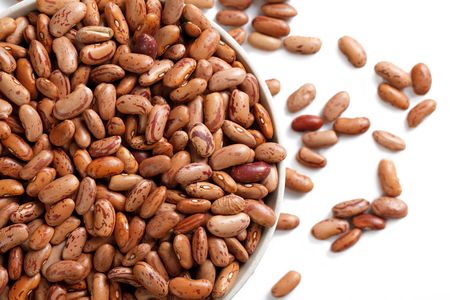 the beans in bowl on white backgroundの写真素材