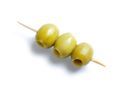 photo shot of green olives and toothpickの写真素材