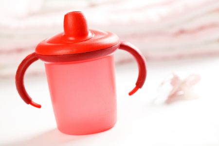photo shot of red baby bottleの写真素材