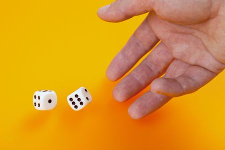 two dice on orange backgroundの写真素材