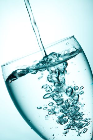 water splashing  into glassの写真素材