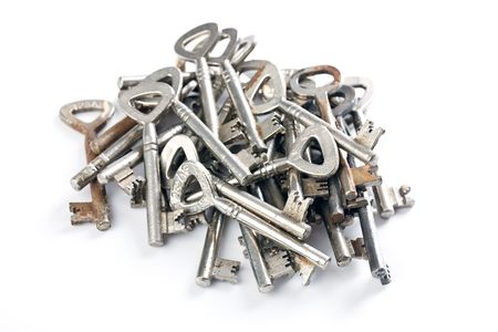 old keys on white backgroundの写真素材