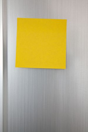 the note paper on chrome backgroundの写真素材