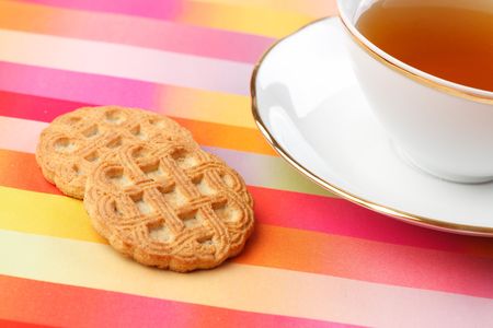 tea and cookie on color backgroundの写真素材