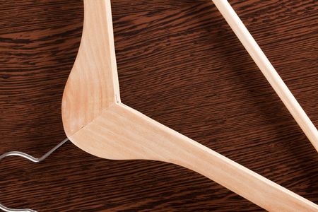 the wooden hanger on wooden backgroundの写真素材