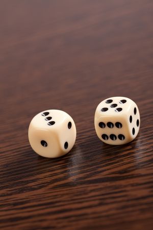 photo shot of dice on wooden tableの写真素材