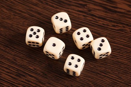 photo shot of dice on wooden tableの写真素材