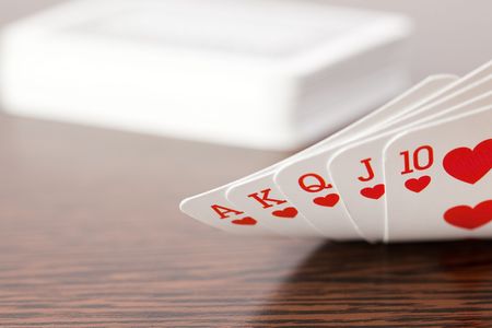the poker cards on wooden tableの写真素材