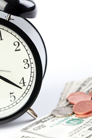 the alarm clock and money on white backgroundの写真素材