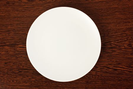 plate on a wooden tableの写真素材