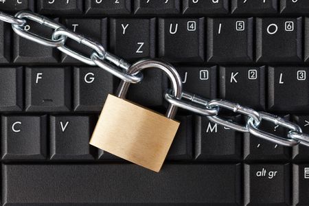 secured laptop on wooden backgroundの写真素材
