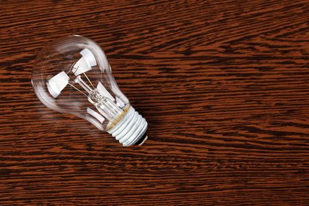 light bulb on wooden tableの写真素材