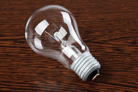 light bulb on wooden tableの写真素材