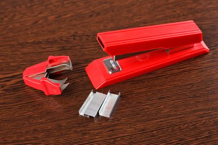 office stapler on wooden tableの写真素材