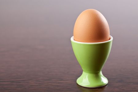 photo shot of egg in egg cupの写真素材