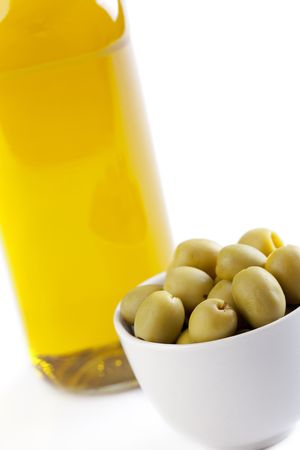 olives and olive oil on white backgroundの写真素材