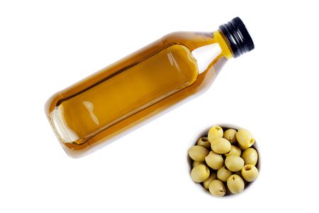 olives and olive oil on white backgroundの写真素材