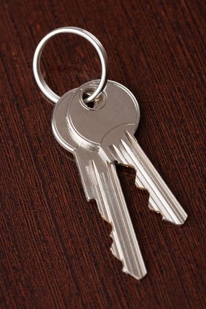 two keys on wooden backgroundの写真素材