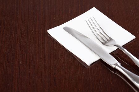 photo shot of cutlery on wooden tableの写真素材