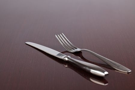 photo shot of cutlery on wooden table