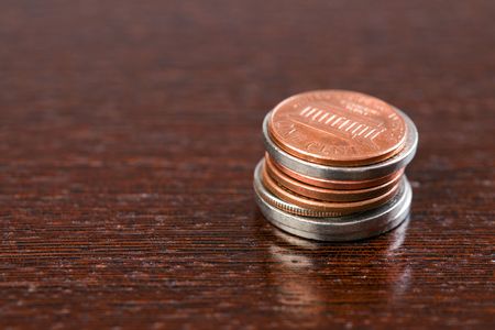 the coins on wooden tableの写真素材