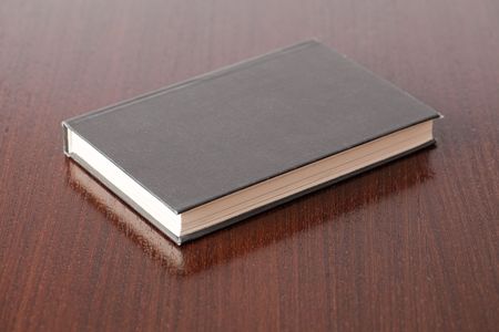 the photo shot of book on wooden tableの写真素材