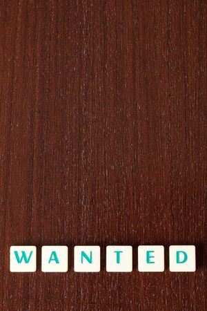 sign wanted on wooden backgroundの写真素材