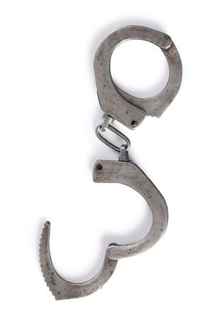the old handcuffs on white backgroundの写真素材