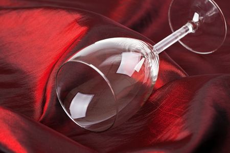 the wine glass on red backgroundの写真素材