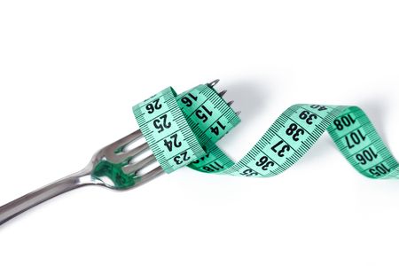  fork with measuring tape on white backgroundの写真素材