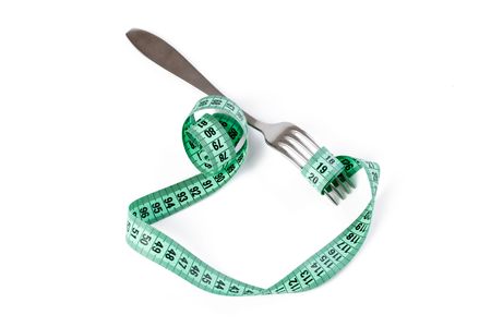  fork with measuring tape on white backgroundの写真素材